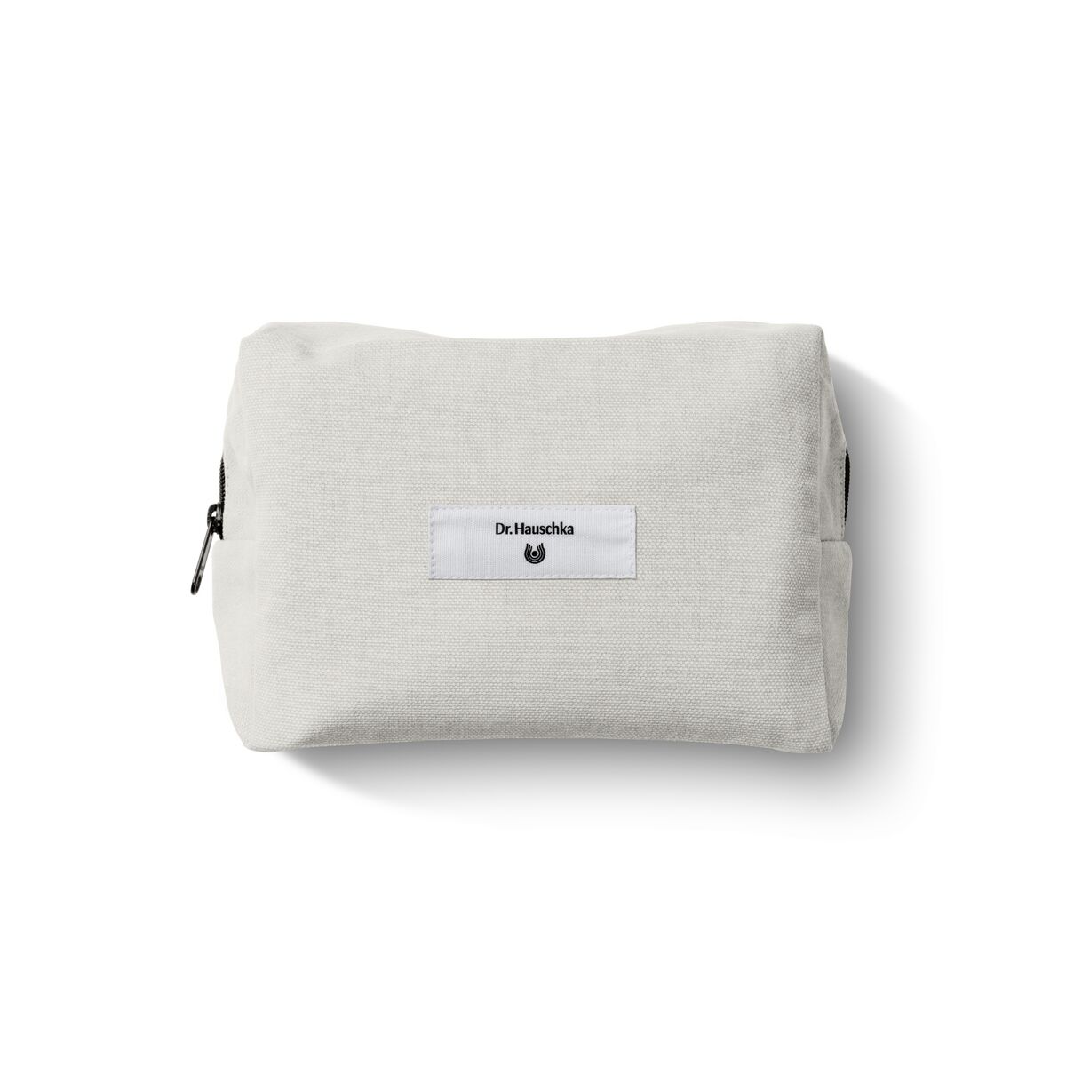 Kosmetiktasche aus Stoff mit Dr. Hauschka Naturkosmetik-Label, offwhite