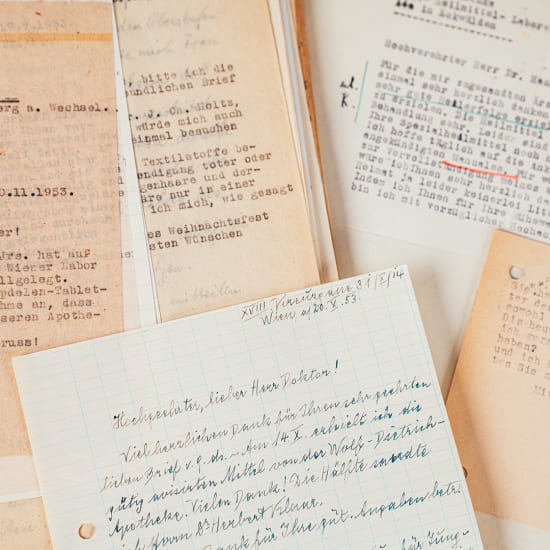 Historical handwritten and typed letters on paper